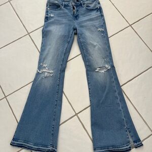 American Eagle Flare Leg Jeans with Distressed Knees and Hem